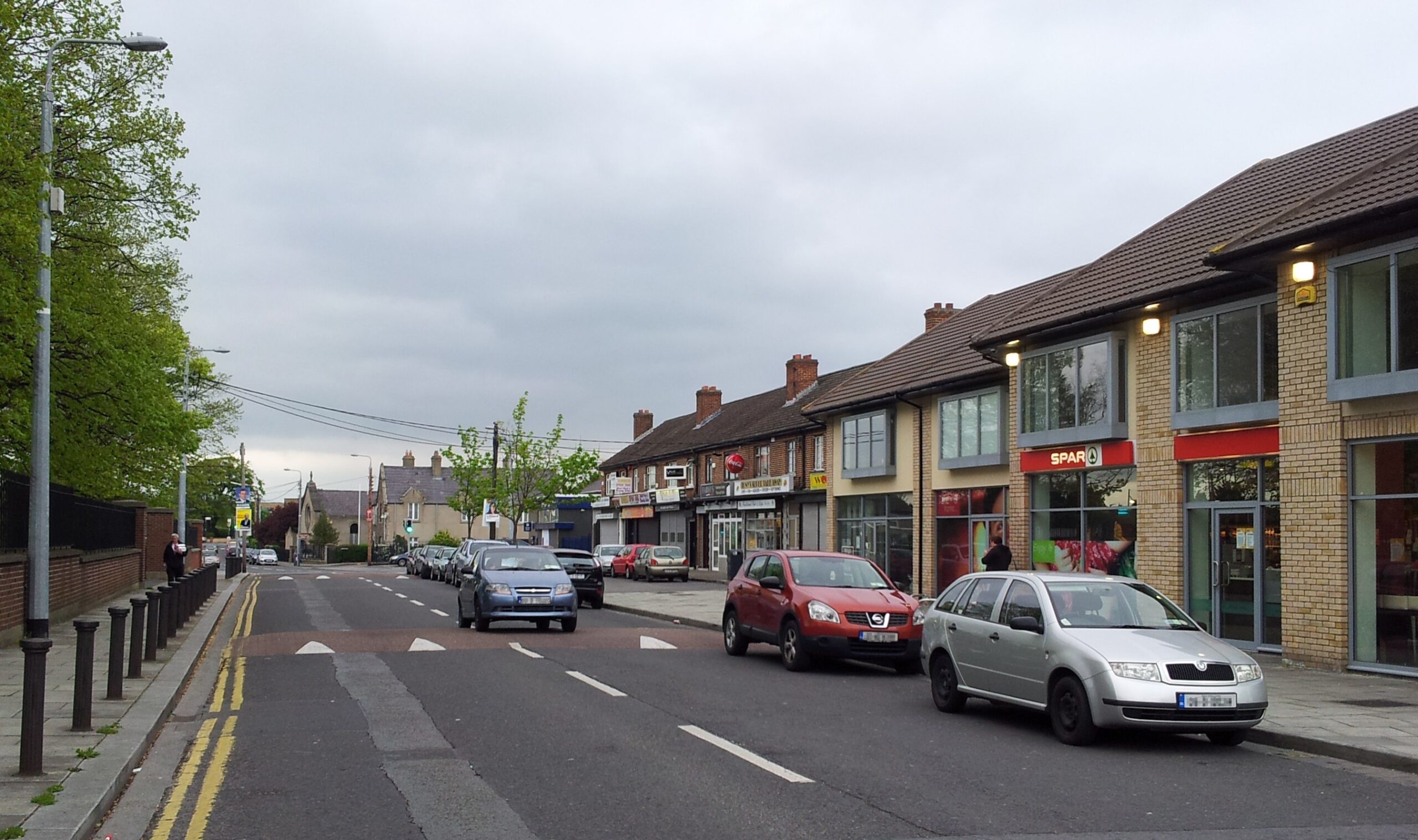 A street with Expert Removals vans parked on it.