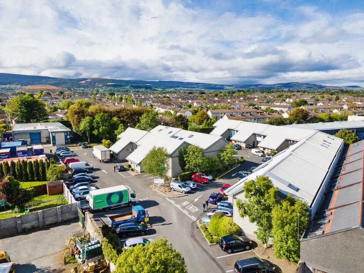 An aerial view of Expert Removals trucks in a parking lot.