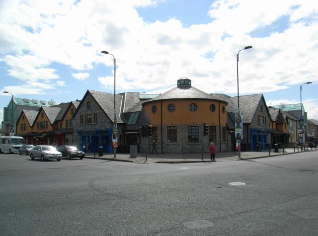 A yellow building on a street offering Expert Removals services.