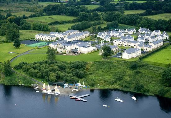 An aerial view of an Expert Removals resort on a lake.