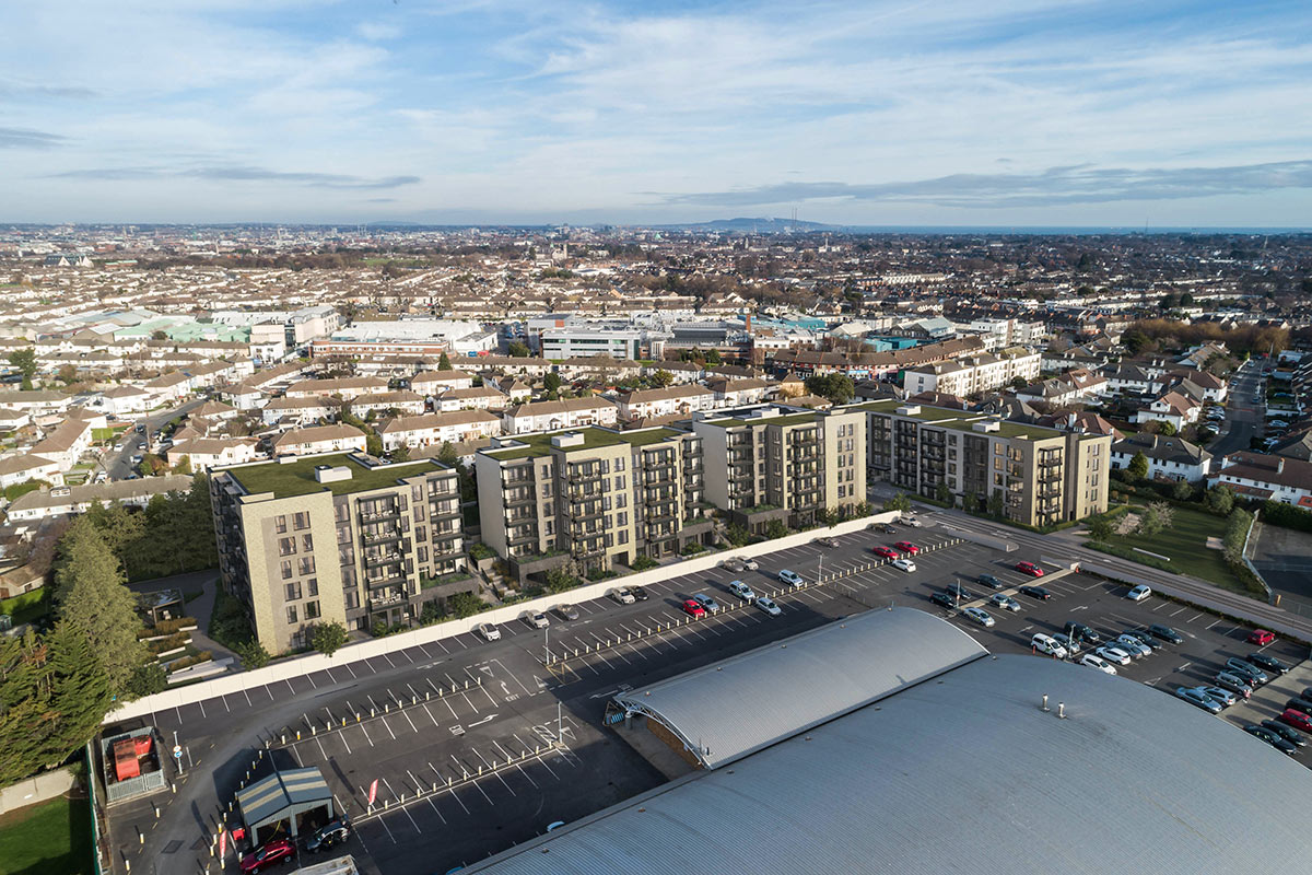 An aerial view of a parking lot and buildings, with Expert Removals truck parked in the lot.